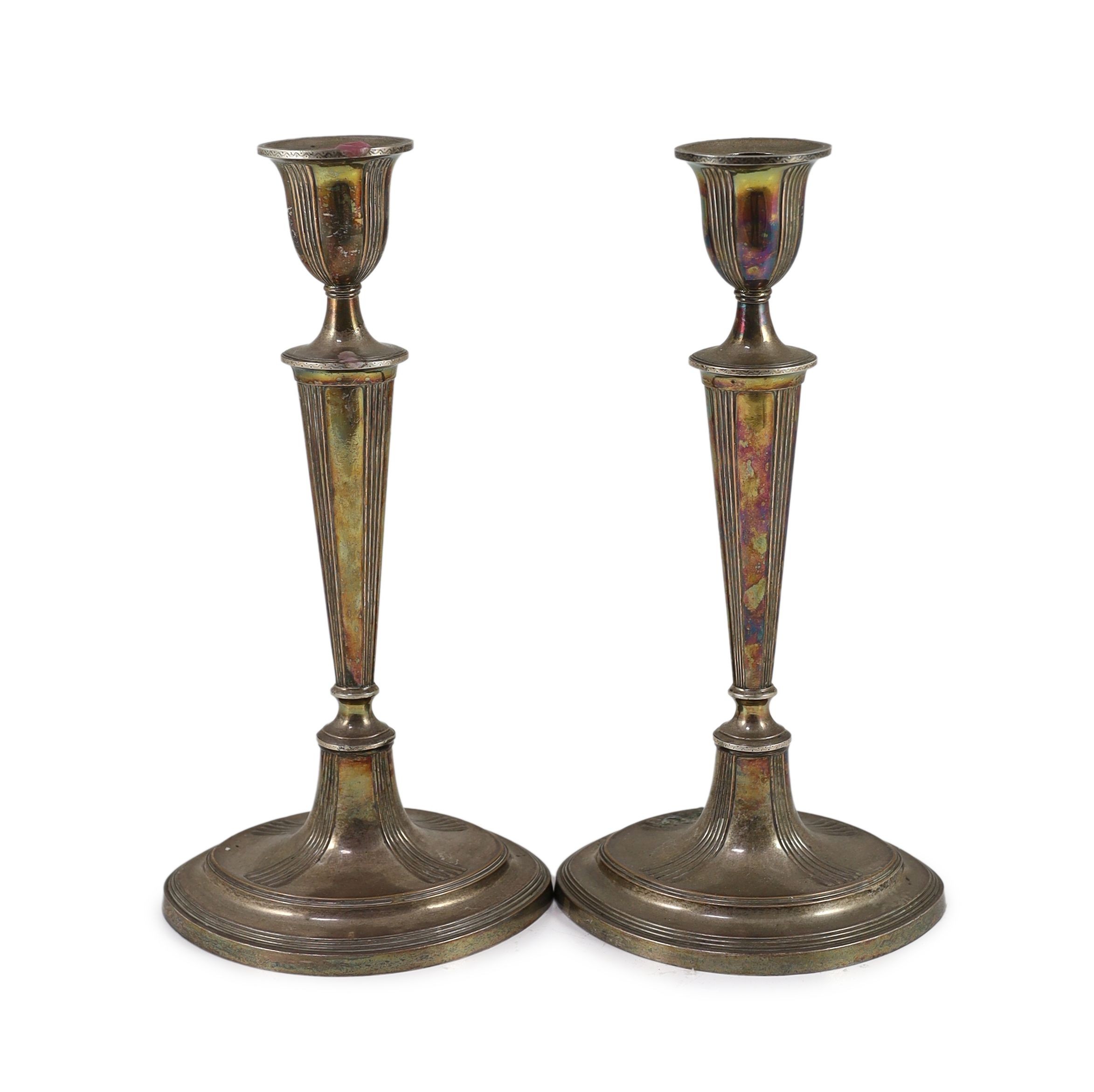 A pair of Sheffield plate candlesticks and nozzles, 32cm high